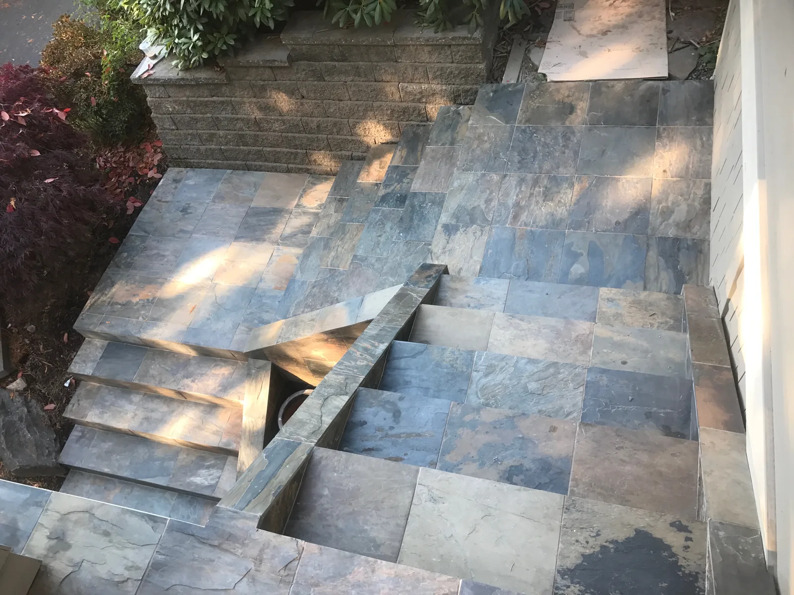 Stone garden steps and terraced landscaping from a PNW Brothers exterior project.